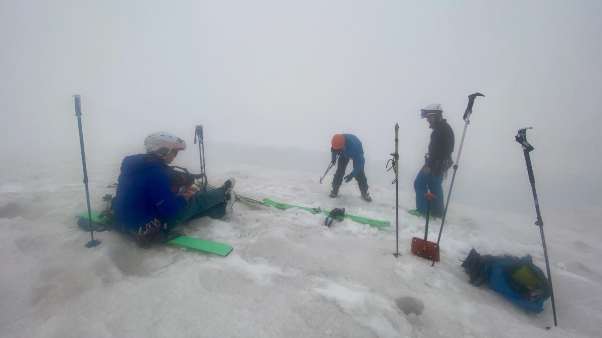 Setting up an anchor after the ski fell into a crevasse.