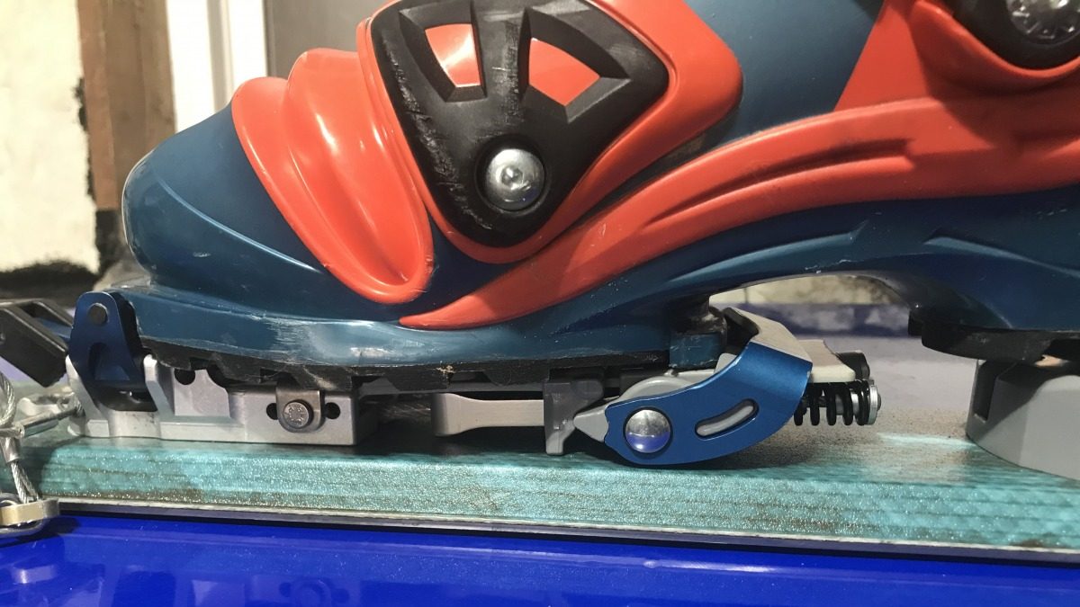 The "Claw" element of the 2nd heel / NTN attachment relies on a pointed cam mechanism working against the tension of the coil springs to lock the "Claw" into the open / touring position. In this mode, only the tech toe engages the boot, same as a classic alpine touring setup.