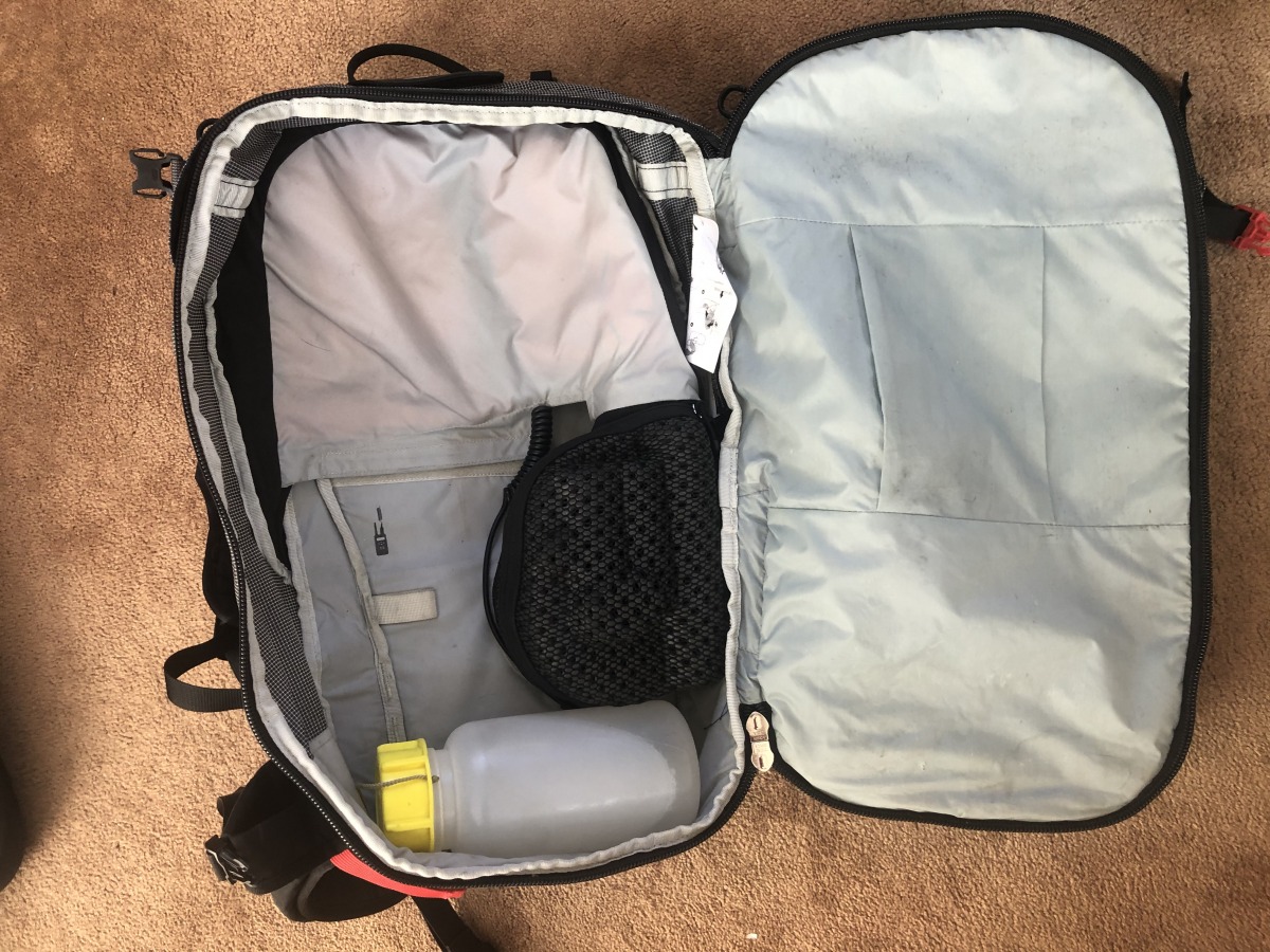 The duffel-style opening with a 1L water bottle for reference.