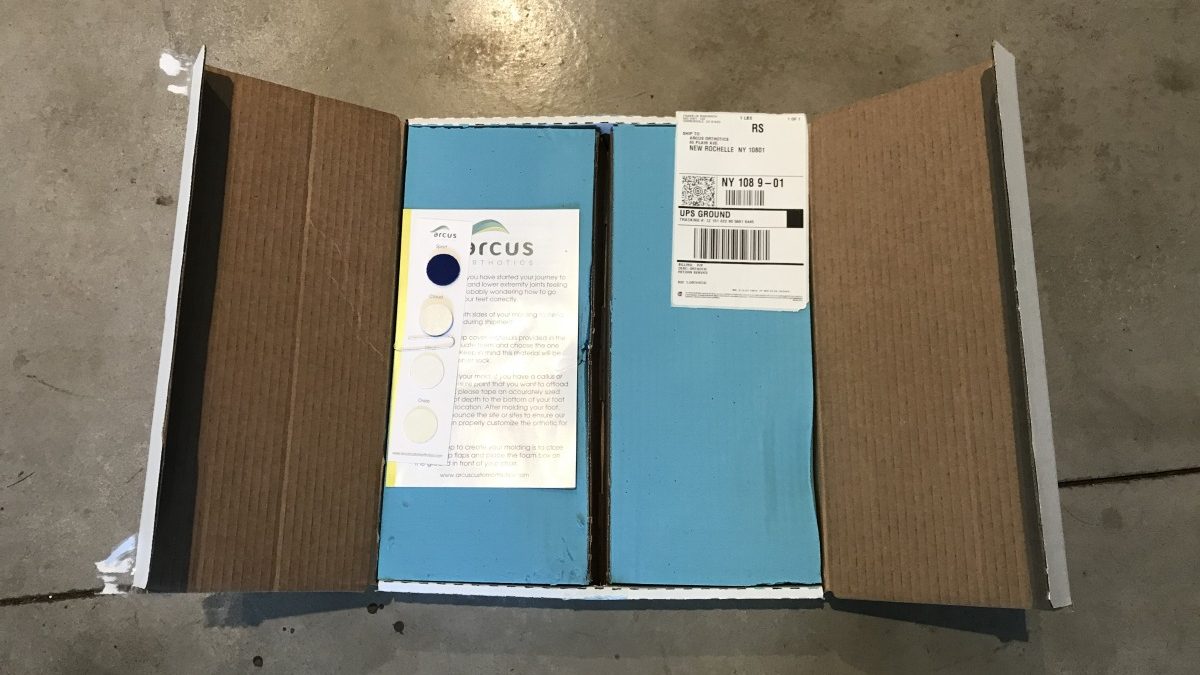 Included in the foam mold box is a sampling of surface materials and a shipping label to send back once you've imprinted your feet.