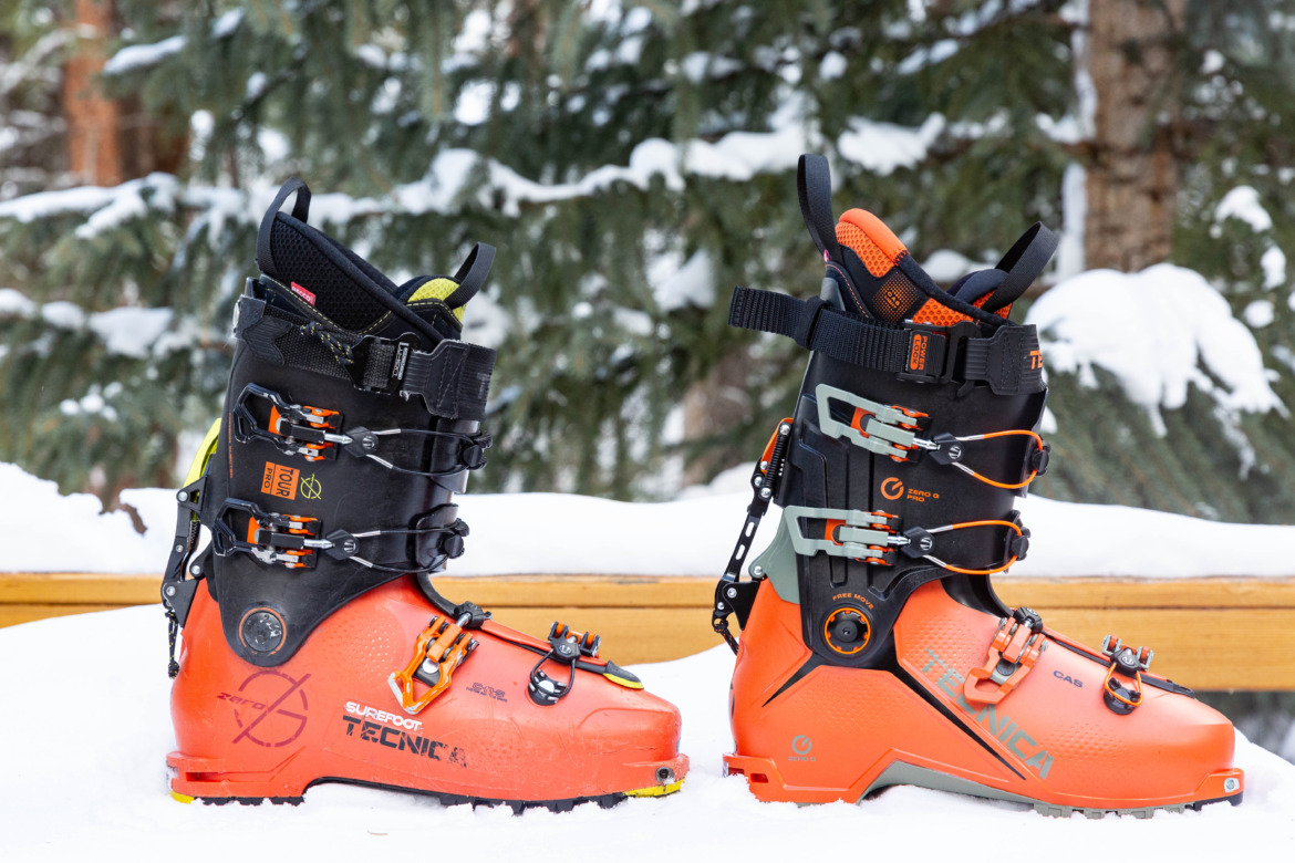 outside view of the old and new versions of the Tecnica Zero G Tour Pro boots side by side in snow with trees in the background