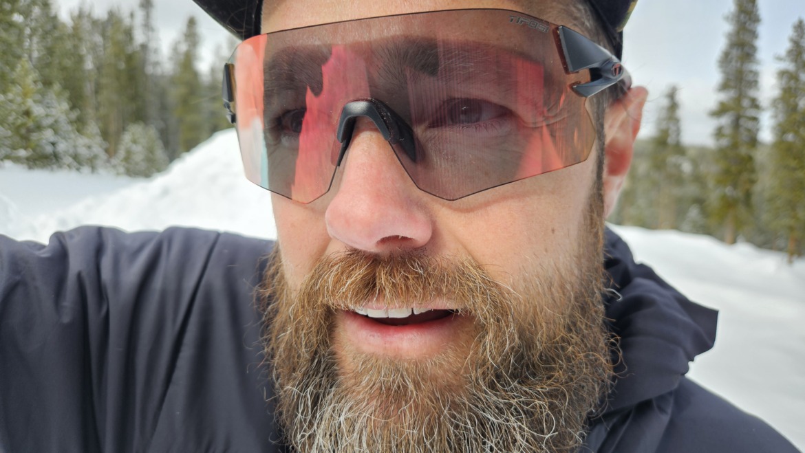 close-up selfie of bearded skier wearing photochromic sunglasses