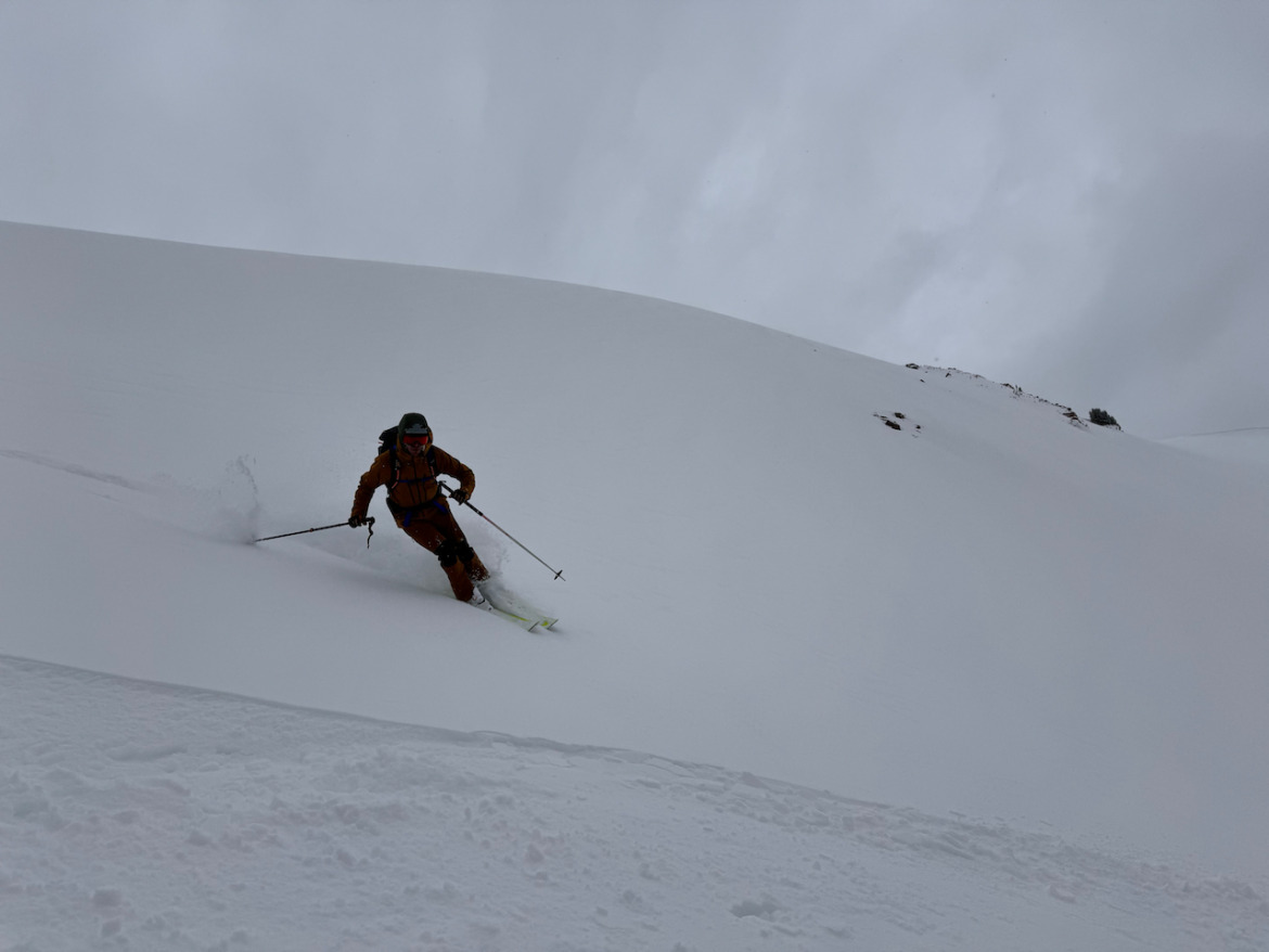 backcountry skier on overcast day turning