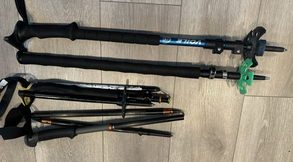 four different types of splitboarding poles in their collapsed states to compare sizes