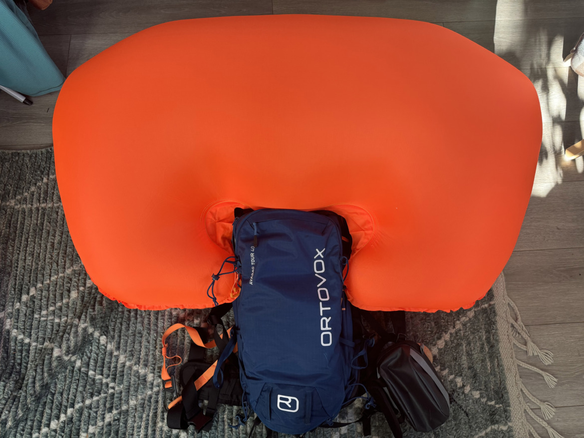 avalanche airbag pack on the ground with airbag inflated