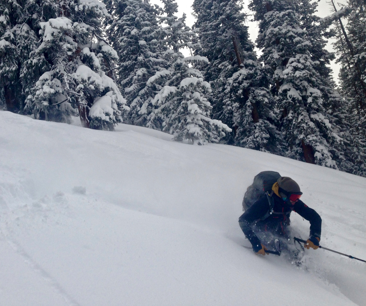 Skier turning in deep snow in the backcountry